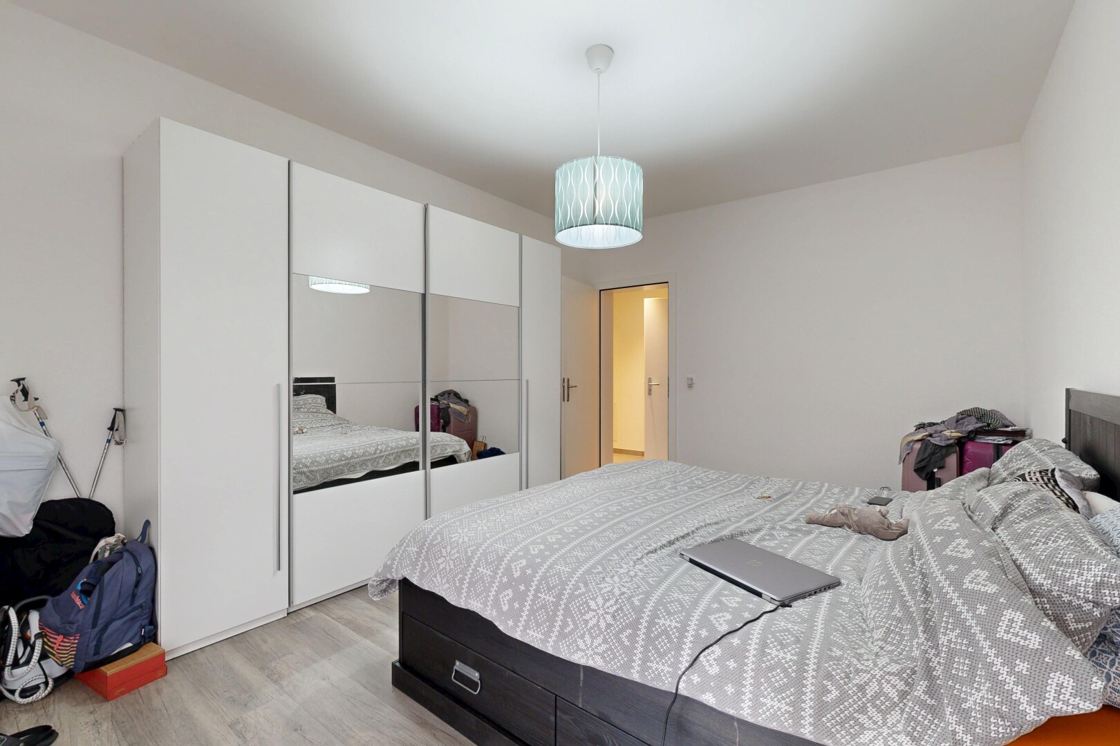 room featuring light wood-style flooring and a closet