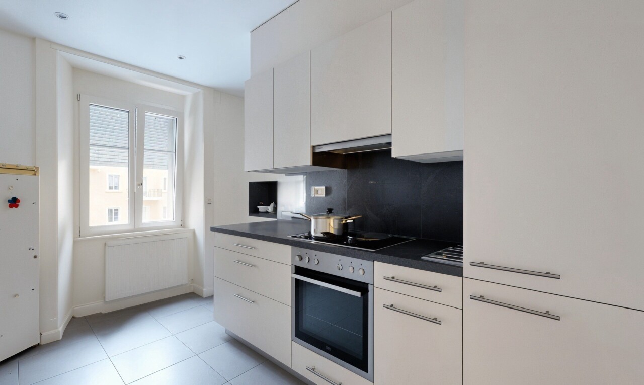 kitchen with dark countertops, white cabinetry, oven, freestanding refrigerator, and decorative backsplash