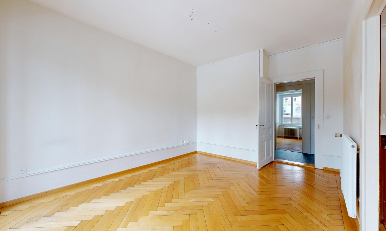 spare room featuring radiator and radiator heating unit