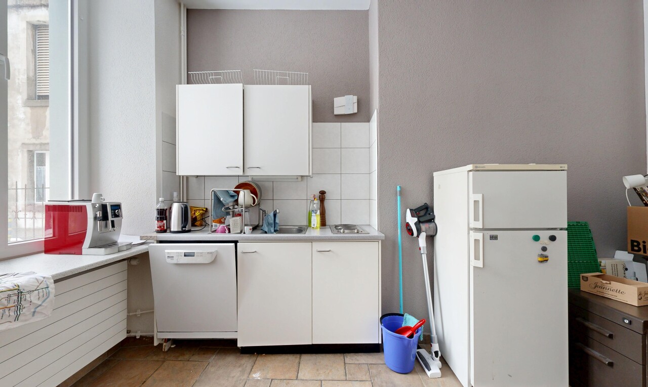kitchen featuring light countertops, white appliances, white cabinetry, and tasteful backsplash