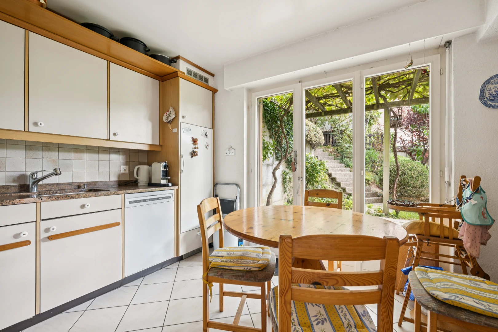küche mit light floor, white cabinets, weiße schränke, kühlschrank, und two tone kitchen