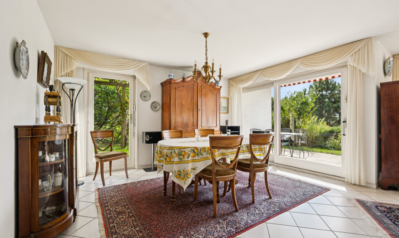 dining area featuring access to outside and light tile patterned floors