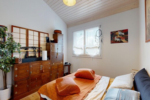 room / bedroom featuring a vaulted wood ceiling and light wood-style flooring