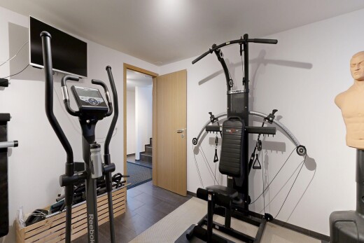 exercise room featuring dark wood-style flooring