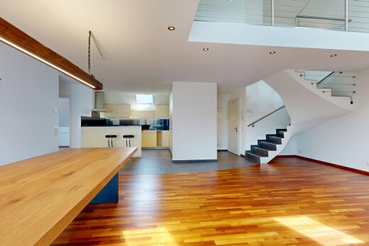 kitchen featuring open floor plan, dark wood-type flooring, ventilation hood, and dark countertops