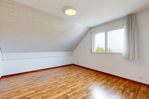 spare room featuring vaulted ceiling and light wood-style floors