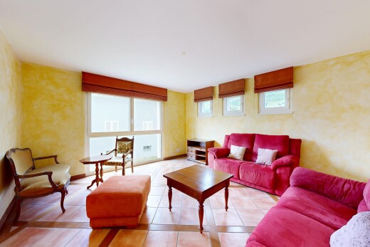 living room with tile patterned flooring