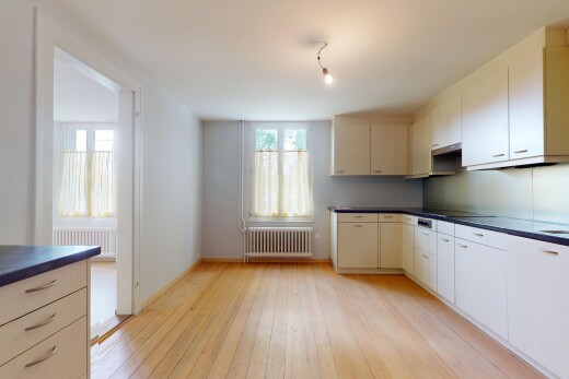 cuisine avec radiateur, plans de travail, lumière naturelle, natural light, et inside property