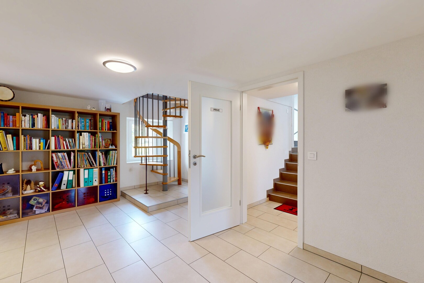 corridor with light tile patterned floors