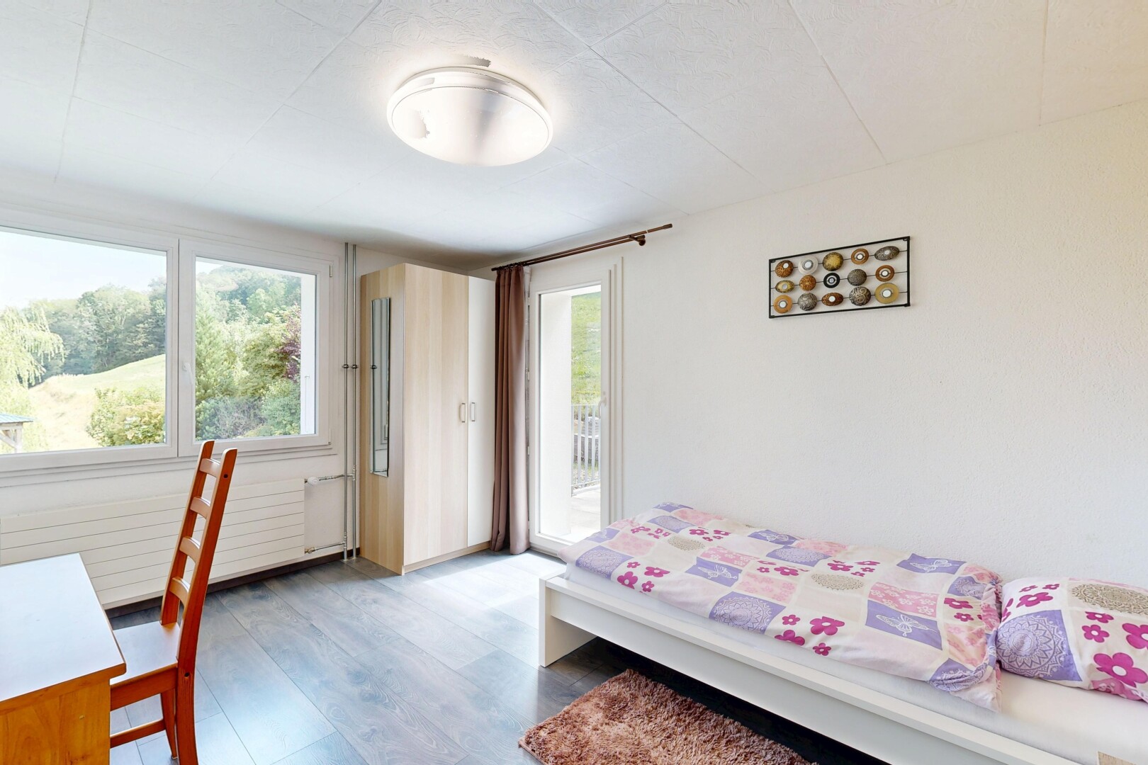 room with access to exterior and dark wood-type flooring