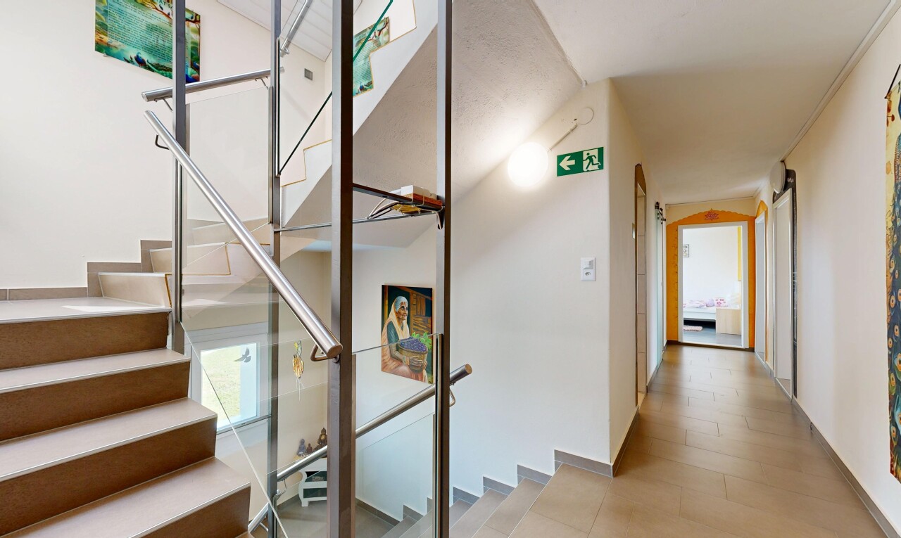 stairway featuring baseboards