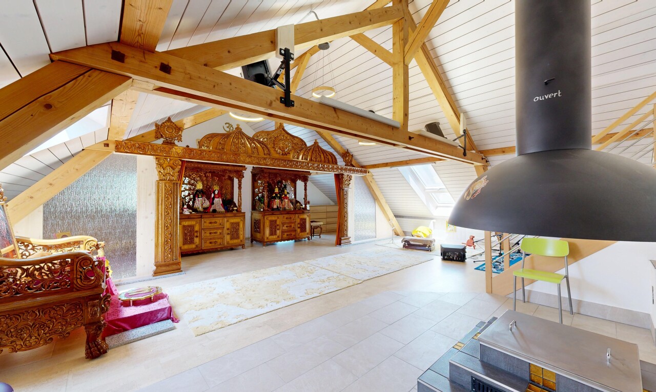 living area featuring beamed ceiling