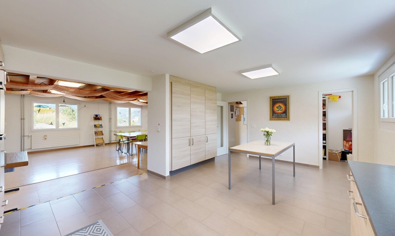 living area with light floors and baseboards