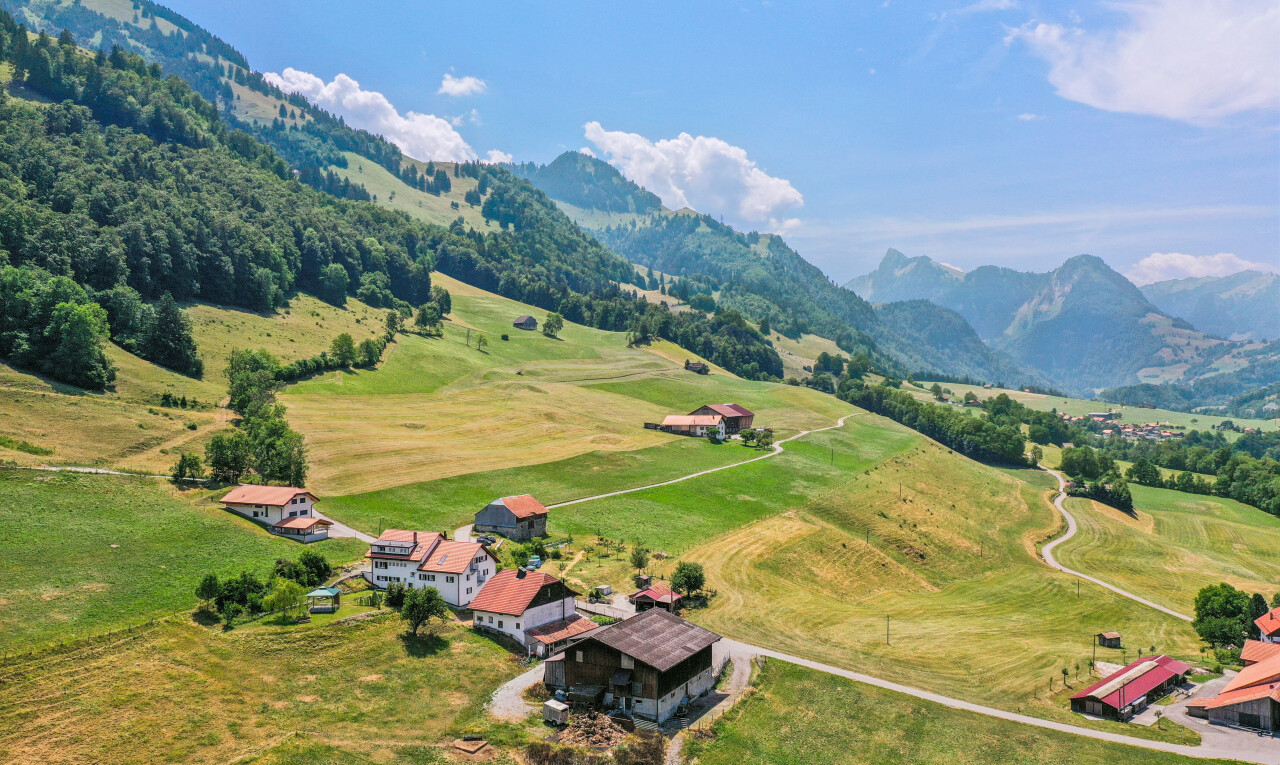 view of mountain background featuring rural landscape