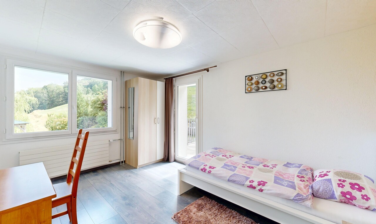 room with access to exterior and dark wood-type flooring