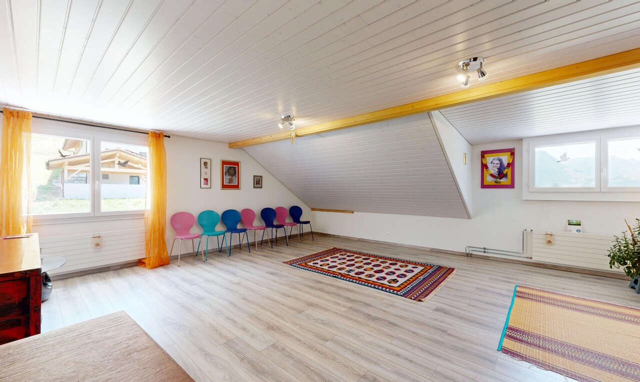 empty room featuring vaulted ceiling and light wood-style floors
