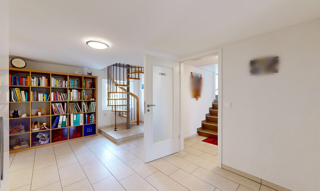 corridor with light tile patterned floors