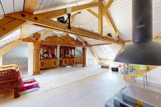 living area featuring beamed ceiling