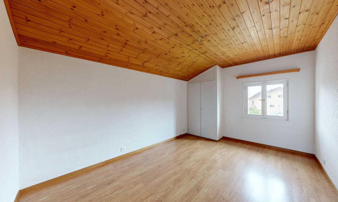 unfurnished room with a vaulted wood ceiling and light wood-style floors