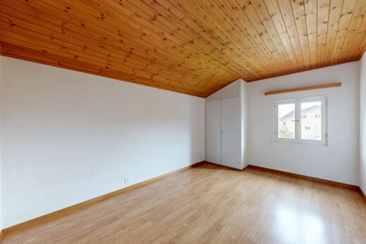 unfurnished room with a vaulted wood ceiling and light wood-style floors
