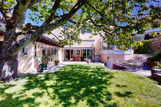 outdoor house with stucco siding and a lawn