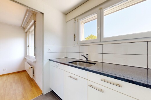 küche mit dark countertops, waschbecken, kühler, gipskartonwand, und drywall