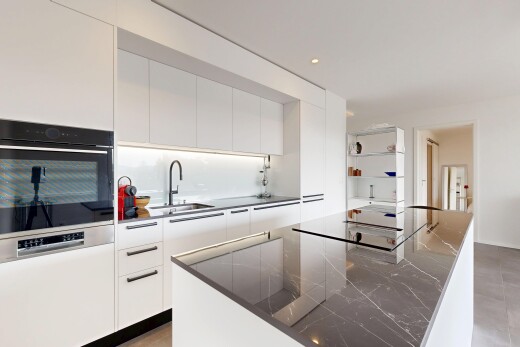 kitchen with modern cabinets, wall oven, a kitchen island, recessed lighting, and white cabinets