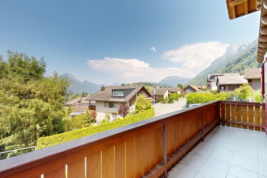 balcony with a mountain view and a residential view