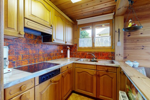 küche mit light countertops, arbeitsplatten, arched cabinets, bogenförmige schränke, und raised cabinets