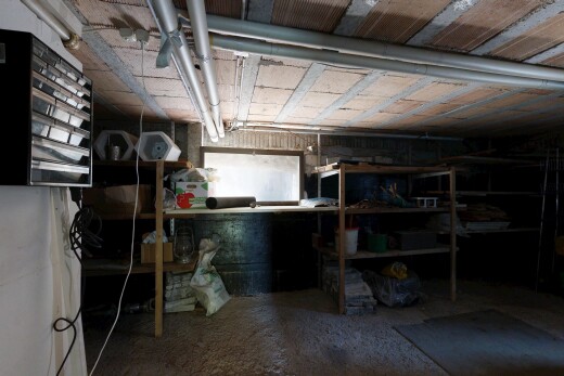 storage room featuring a heating unit