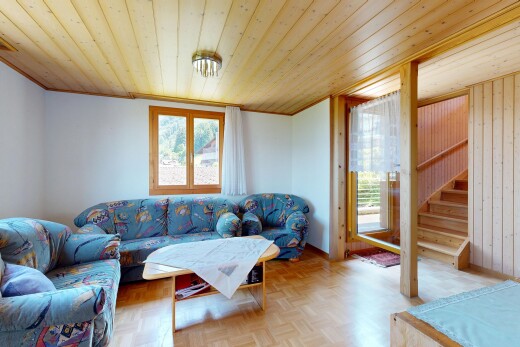 living area with parquet flooring and wood ceiling