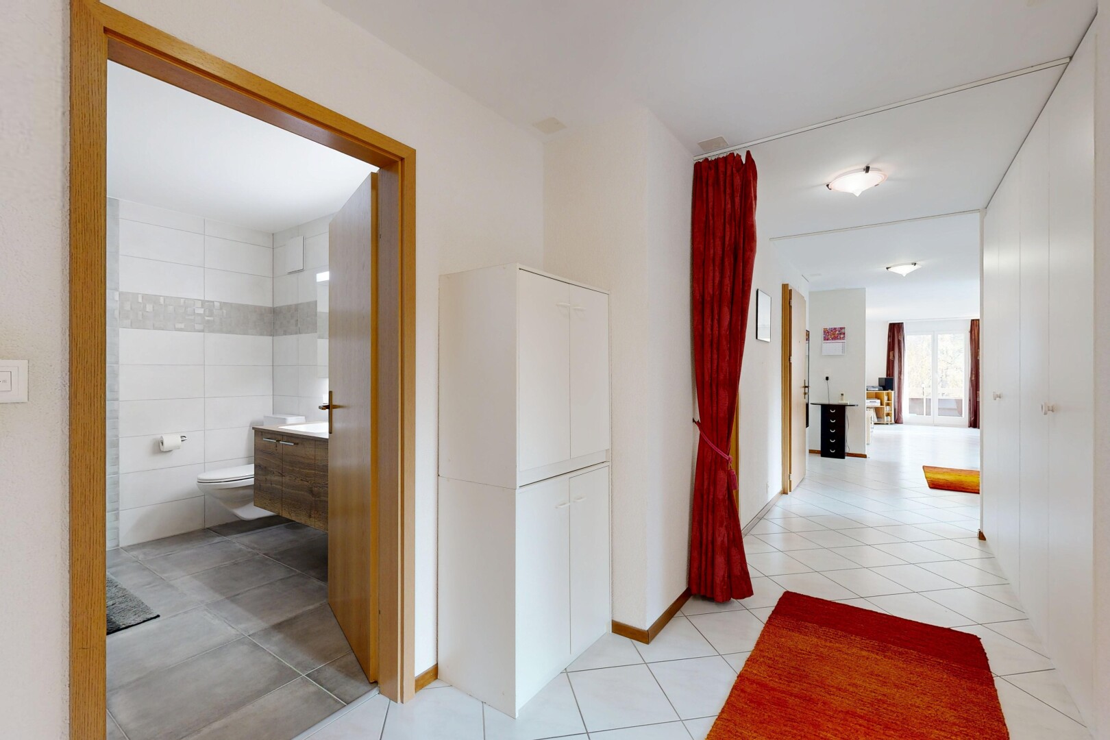corridor featuring light tile patterned floors