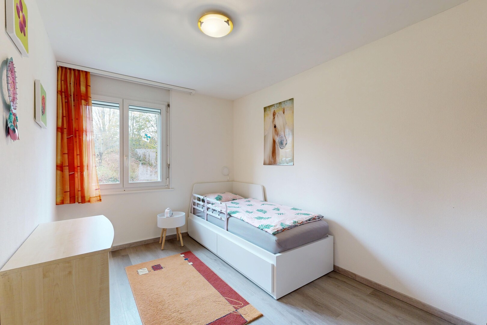 room featuring light wood finished floors and baseboards
