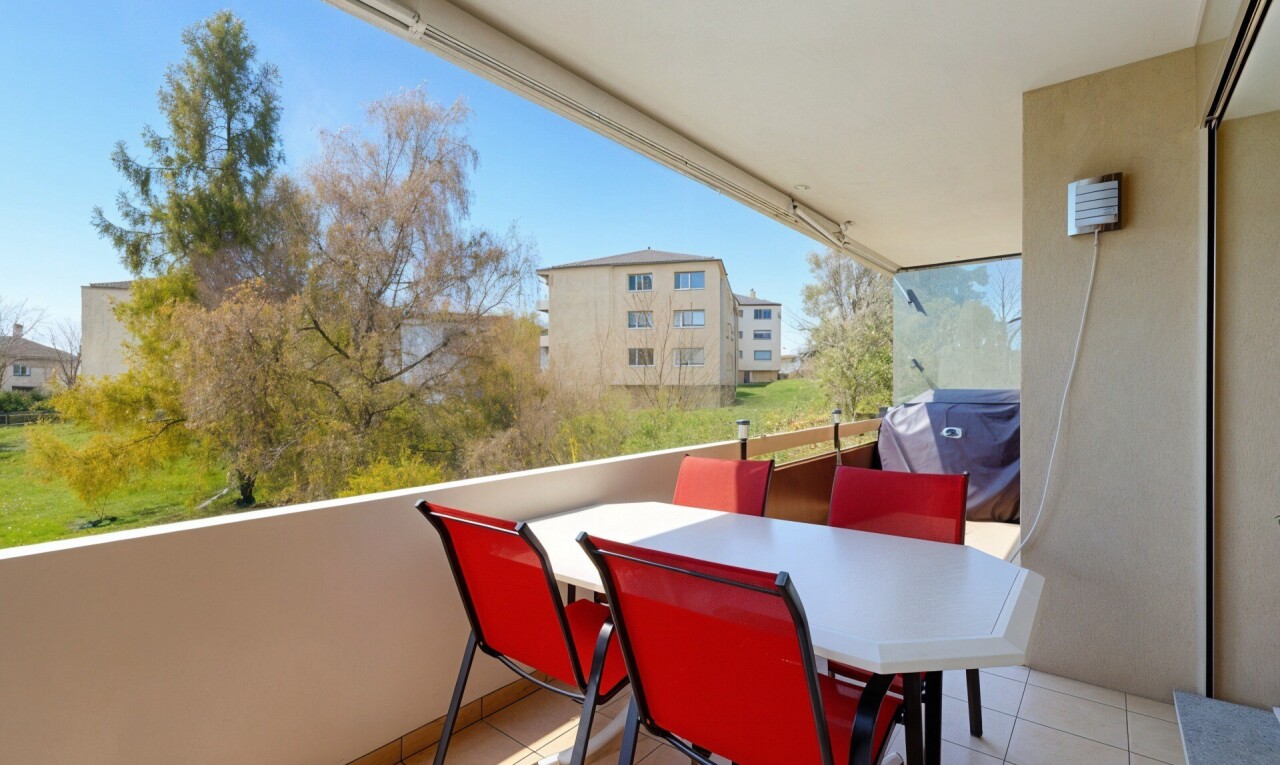 terrace with outdoor dining space, a grill, and a balcony