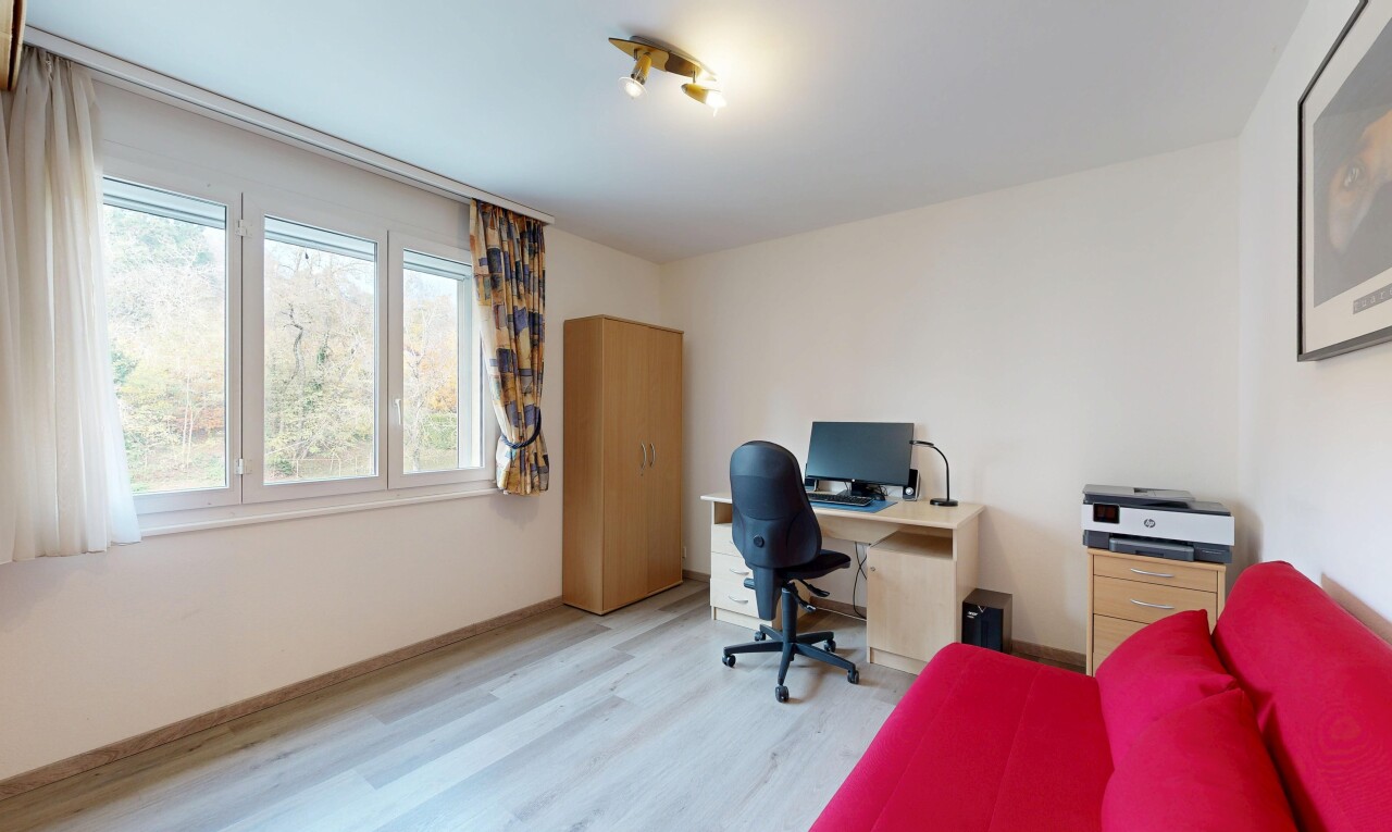 office area featuring light wood-type flooring and baseboards