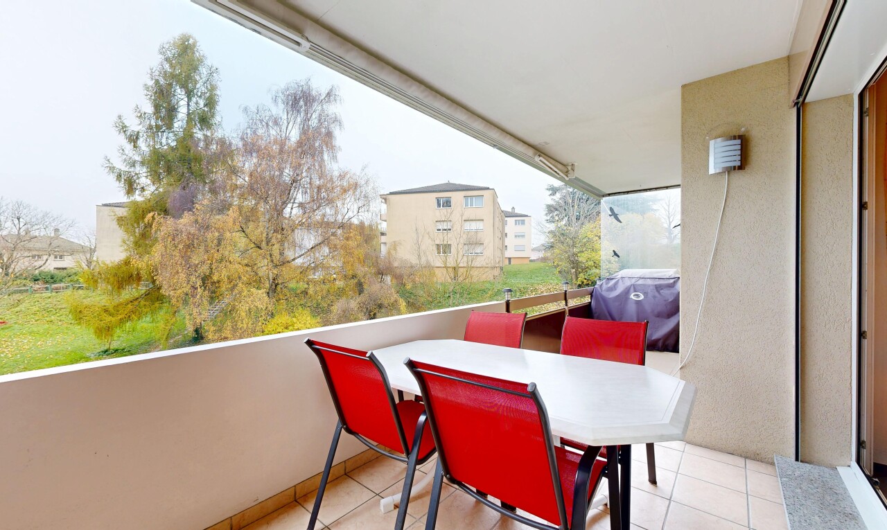 terrace with outdoor dining space, a grill, and a balcony