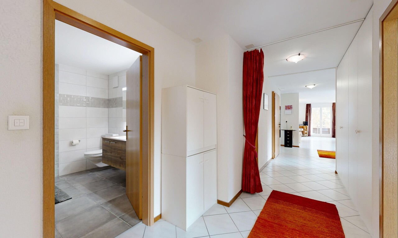 corridor featuring light tile patterned floors