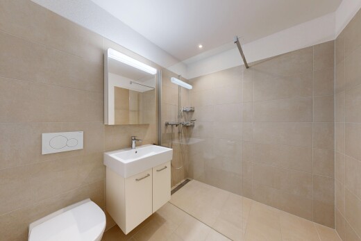full bathroom with walk in shower, vanity, tile walls, and recessed lighting