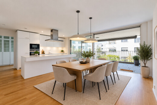 dining space with hanging light fixtures, light wood finished floors, and access to exterior