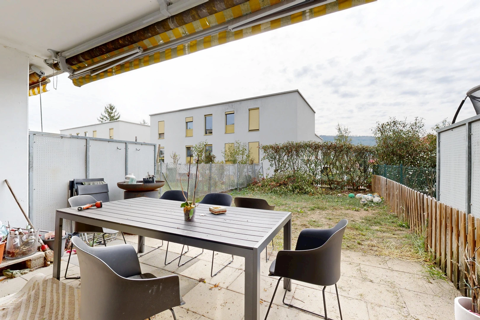 terrace featuring a fenced backyard, a patio area, and outdoor dining area