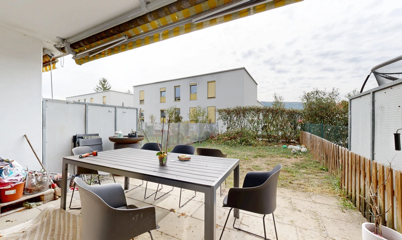 terrace featuring a fenced backyard, a patio area, and outdoor dining area