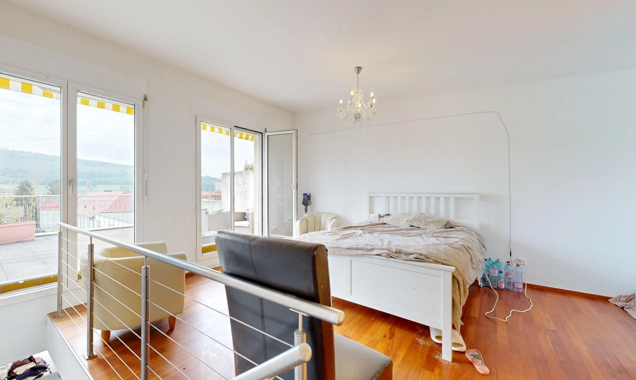 room featuring access to outside and wood finished floors