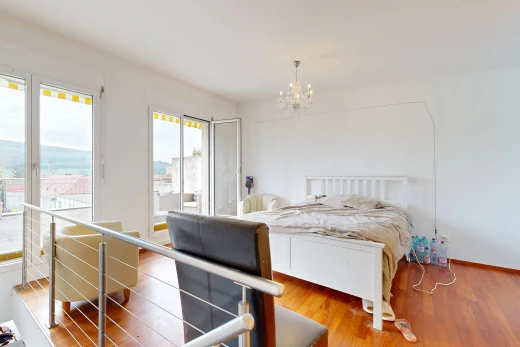 room featuring access to outside and wood finished floors