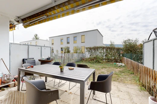 terrace featuring a fenced backyard, a patio area, and outdoor dining area