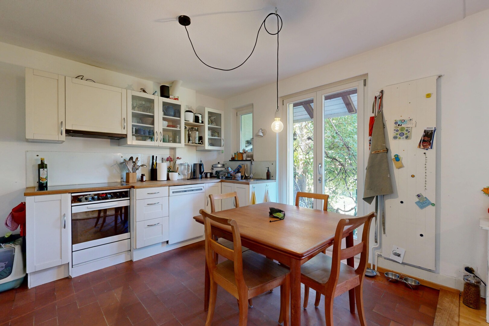 kitchen with white cabinets, glass fronted cabinets, stainless steel oven, dishwasher, and dark wood-style floors