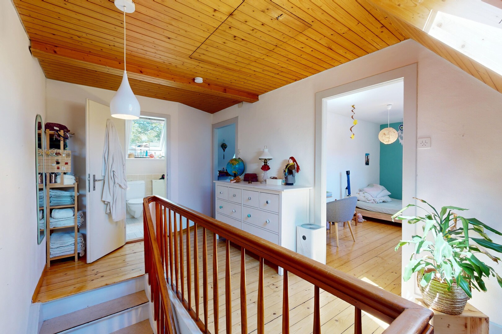 upstairs landing featuring pendant lighting, a wood ceiling with exposed beams, and wood-type flooring