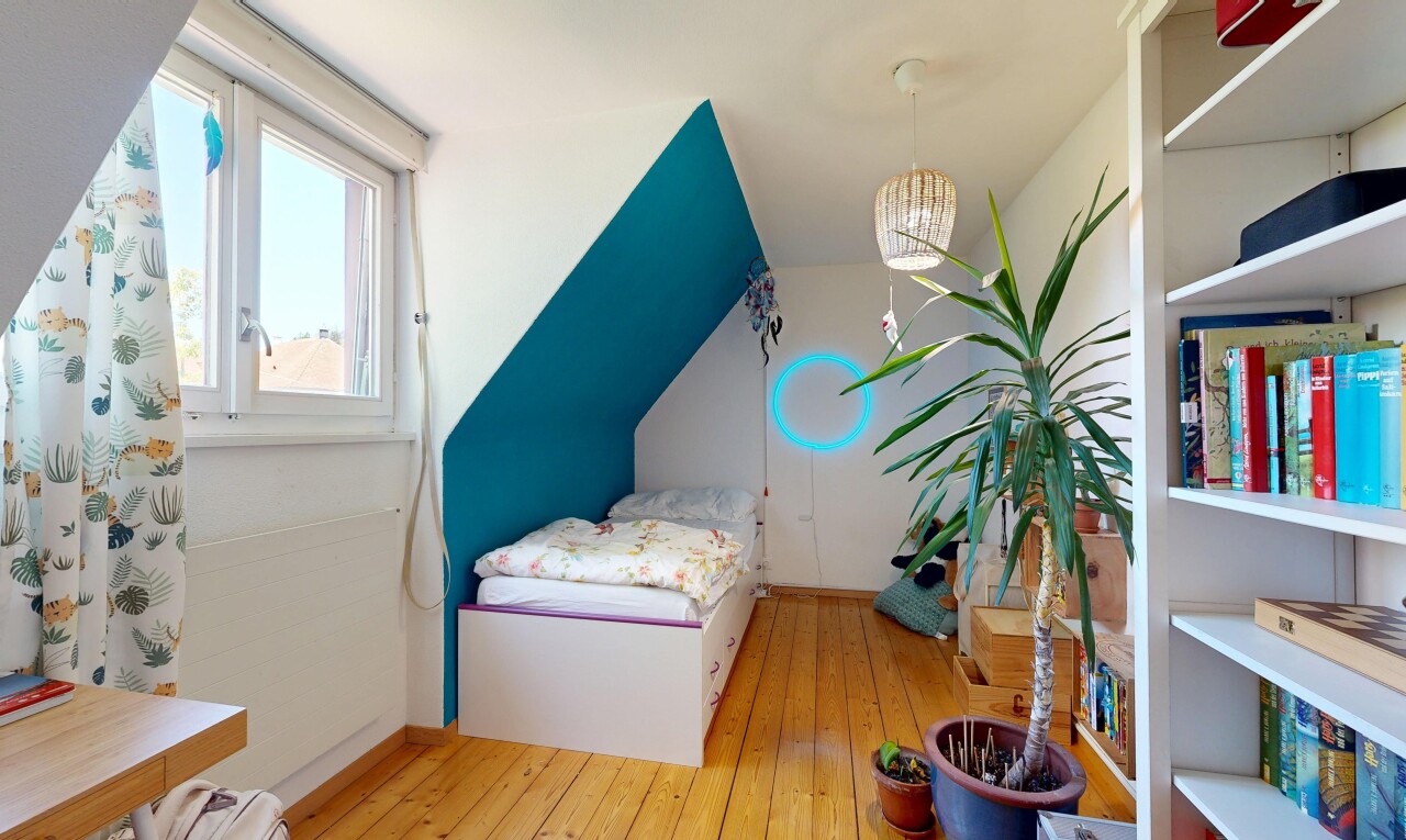 room with light wood-style floors, vaulted ceiling, and built in features