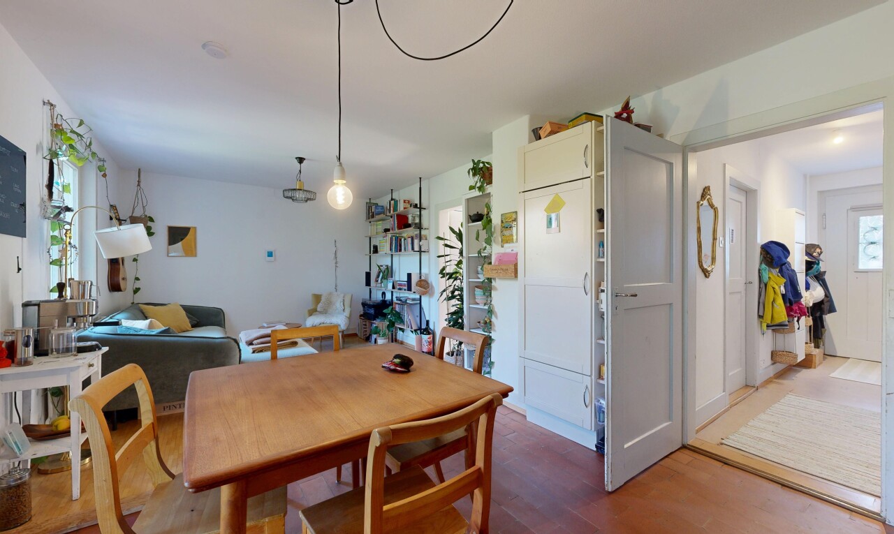 dining space with wood finished floors