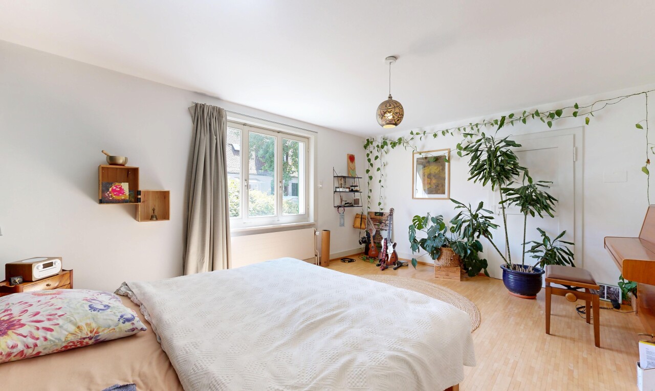room featuring pendant lighting and light wood-type flooring