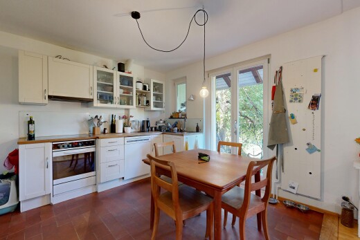 kitchen with white cabinets, glass fronted cabinets, stainless steel oven, dishwasher, and dark wood-style floors